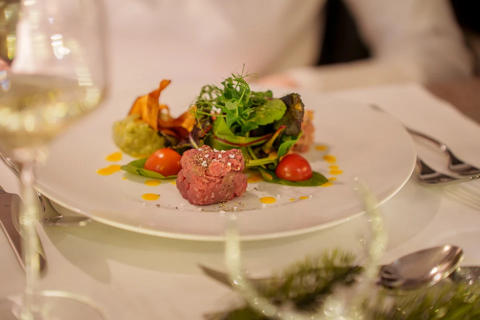 Carefully plated starter on a set dining table
