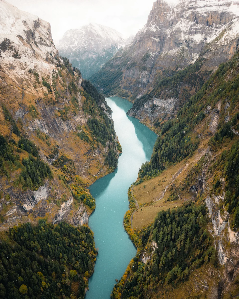 Turquoise lake between steep rock faces