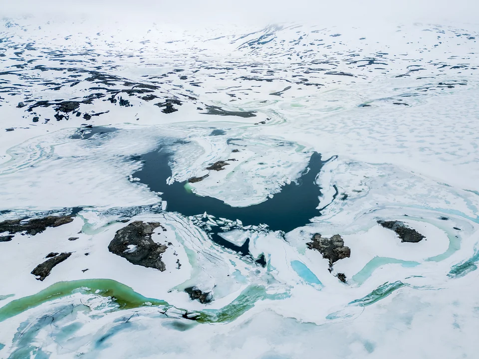 Abstract waterways in a snow-covered landscape
